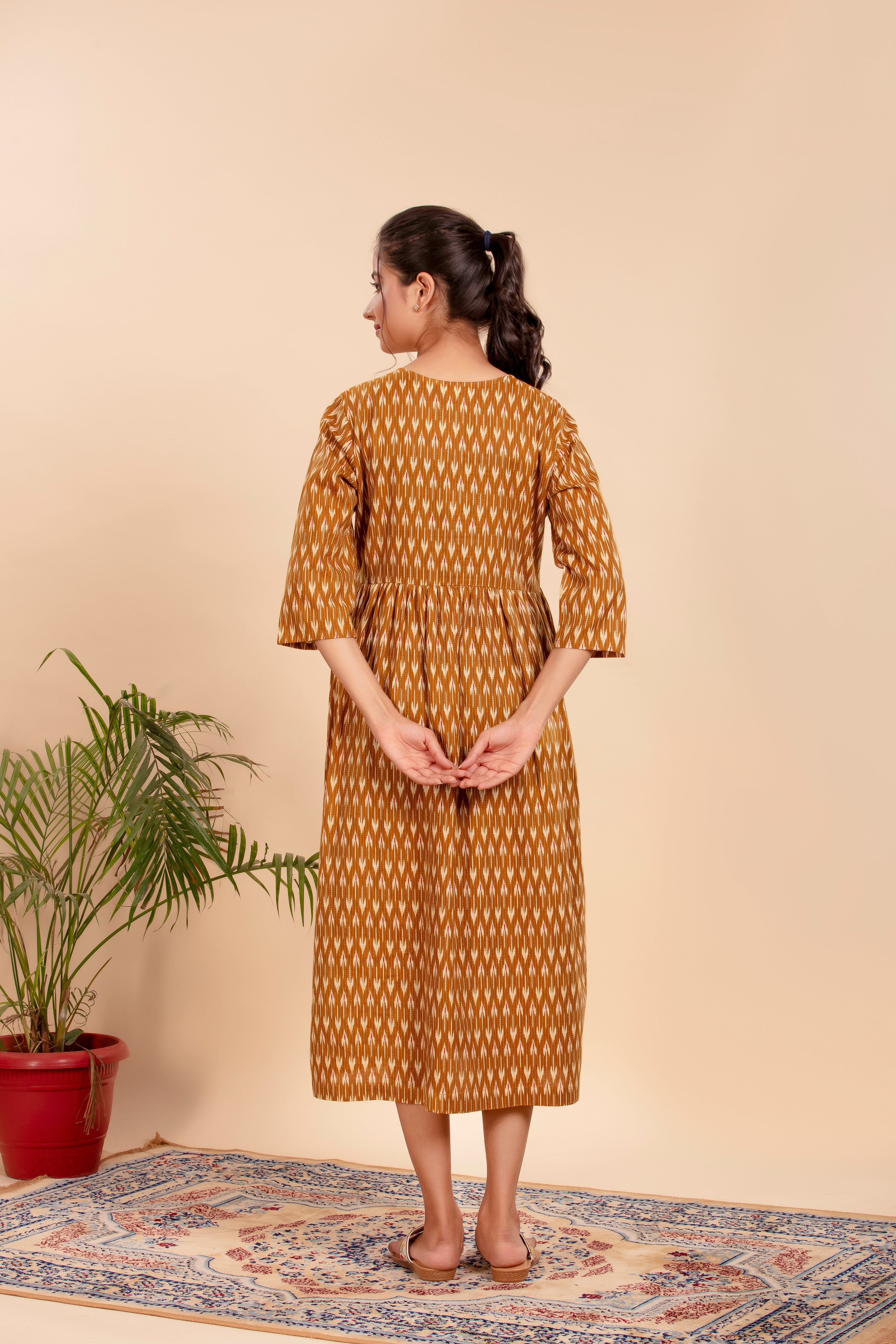 Dress Up in Effortless Style with this Mustard Ikat-Printed Midi Dress.