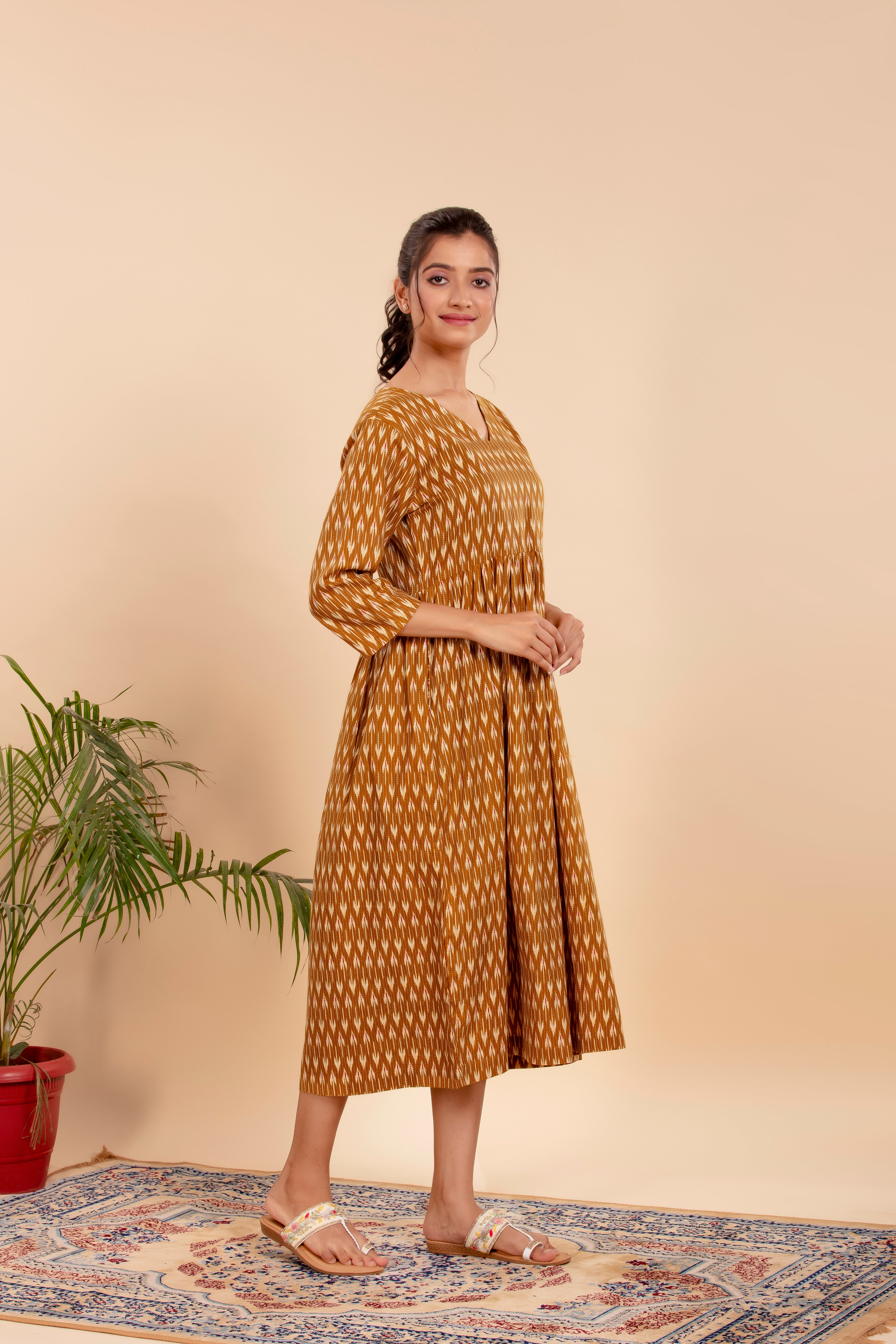 Dress Up in Effortless Style with this Mustard Ikat-Printed Midi Dress.