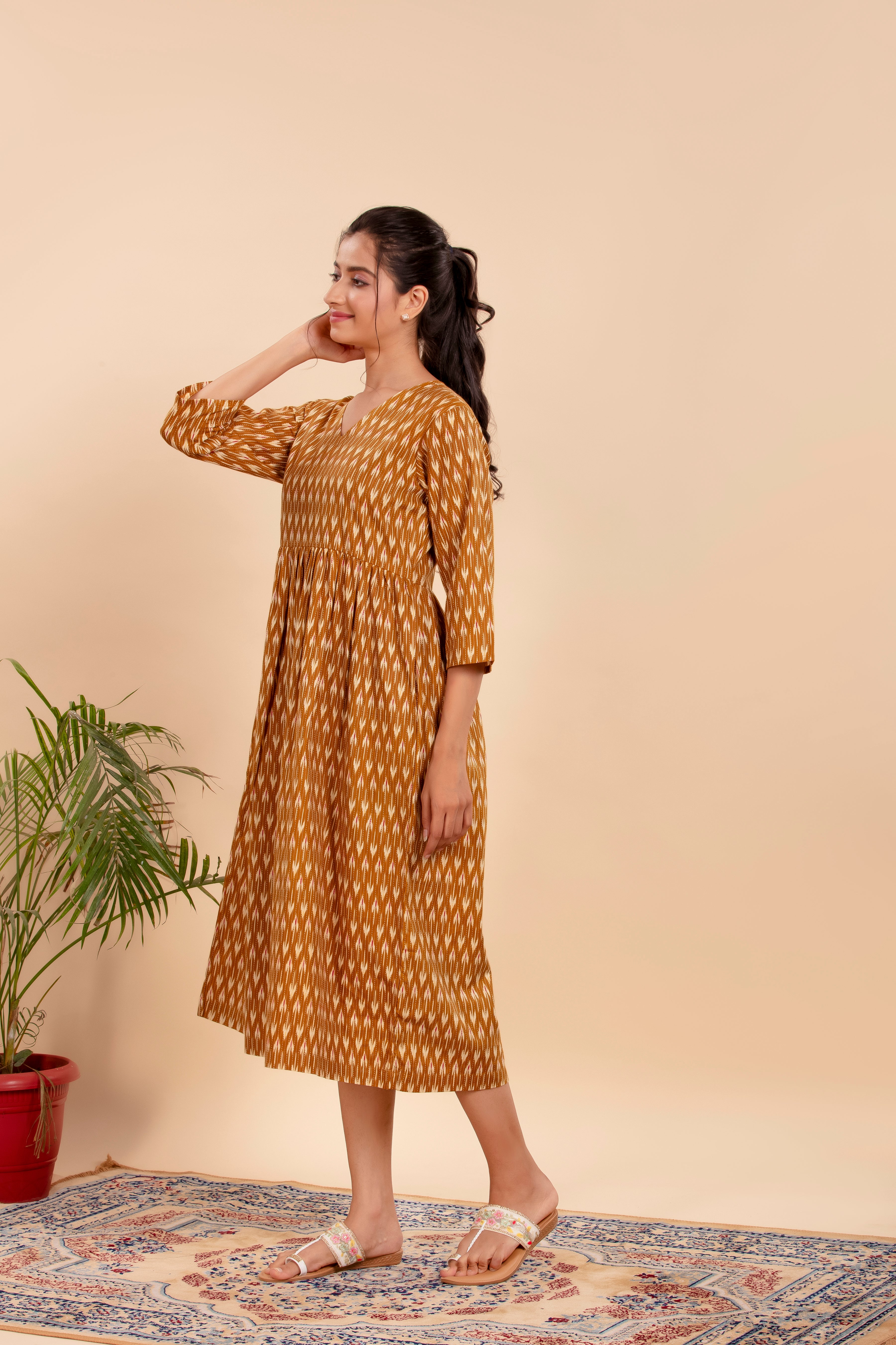 Dress Up in Effortless Style with this Mustard Ikat-Printed Midi Dress.