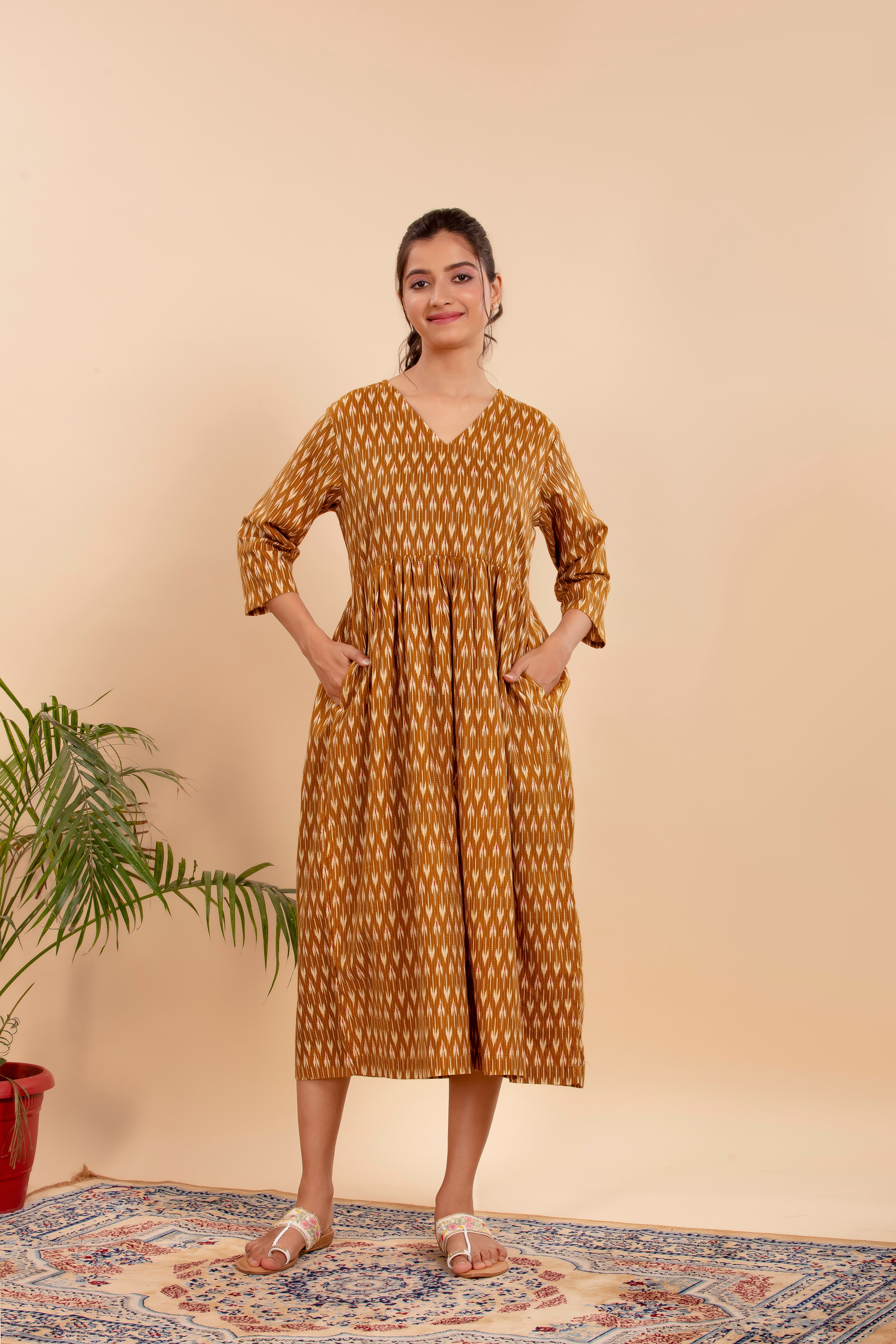 Dress Up in Effortless Style with this Mustard Ikat-Printed Midi Dress.