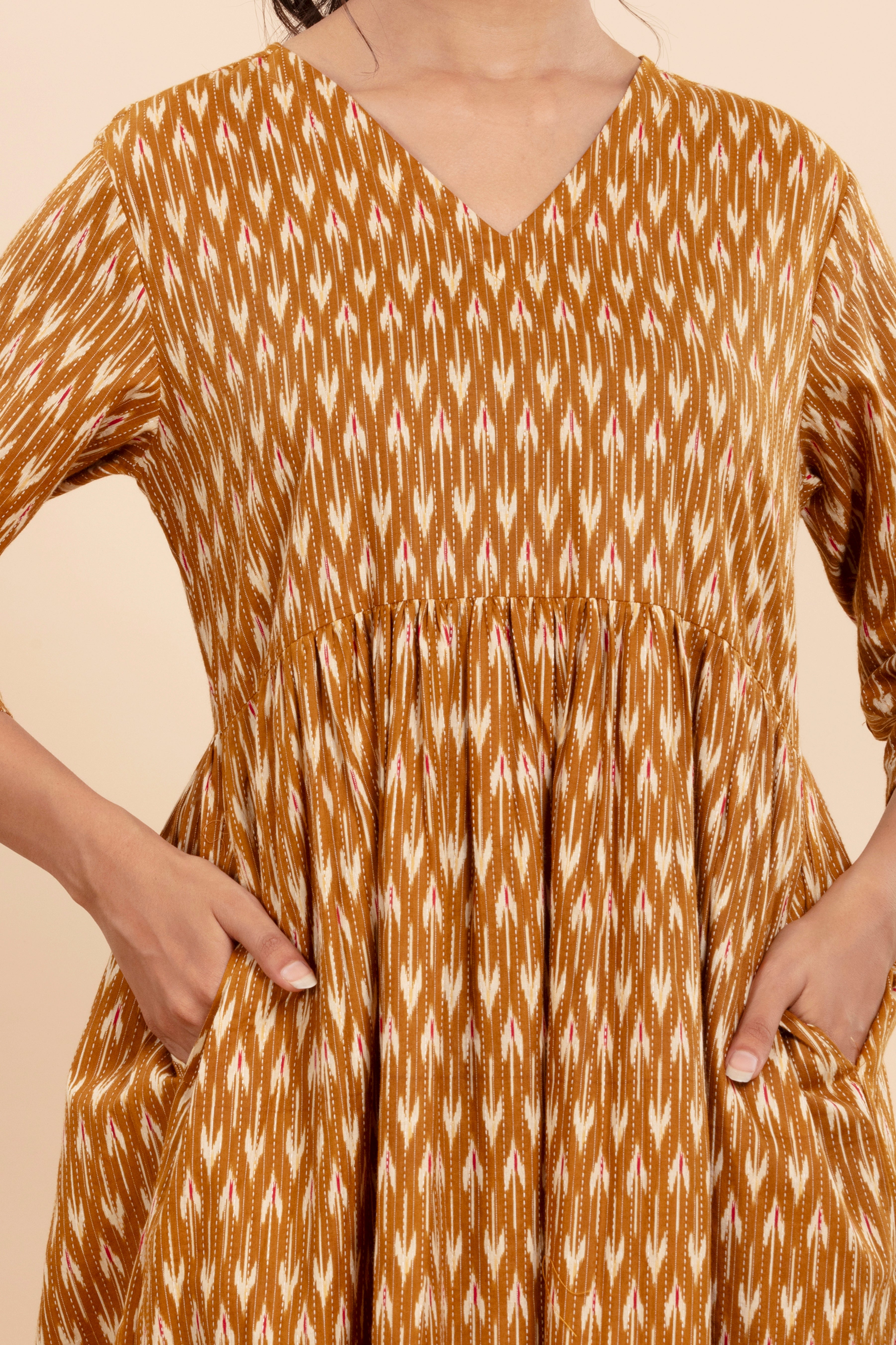 Dress Up in Effortless Style with this Mustard Ikat-Printed Midi Dress.
